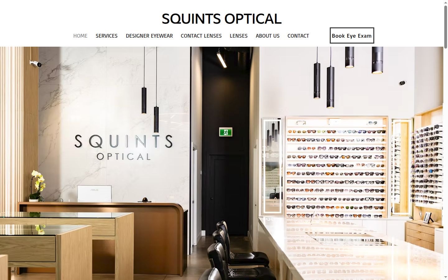The Squints Optical website homepage: the store's frame wall and front desk