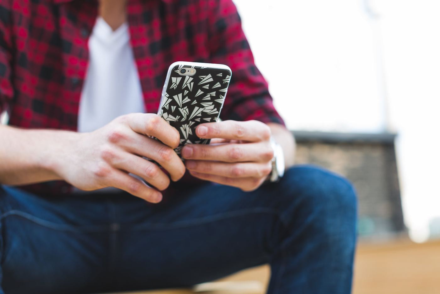 A person reading a message on their phone